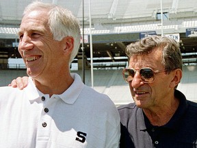 In this Aug. 6, 1999, file photo, Penn State head football coach Joe Paterno, right, poses with his defensive coordinator Jerry Sandusky during Penn State Media Day at State College, Pa.  (AP Photo/Paul Vathis, File)
