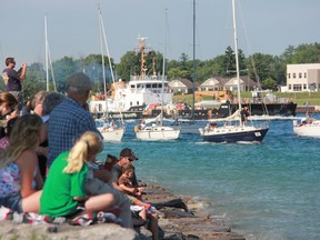 Spectators are shown in this file photo lining the shore in Point Edward to watch boats in the Mackinac Island race make their way to Lake Huron. This year's race is is set to begin Saturday morning. (File photo)