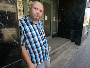 Dave McCallum stands in a doorway on Richmond Street just south of Dundas Street where he chased away two intravenous drug users last week in London. At right is a frame grab from a video of the incident, showing McCallum with a baseball bat after the confrontation. (MORRIS LAMONT, The London Free Press)
