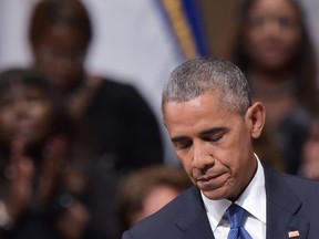 U.S. President Barack Obama pauses speaks during an interfaith memorial service for the victims of the Dallas police shooting at the Morton H. Meyerson Symphony Center on July 12, 2016 in Dallas, Texas. (AFP PHOTO / MANDEL NGANMANDEL NGAN/AFP/Getty Images)