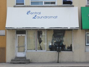 Central Laundromat, pictured on July 6 on Division and Garrett streets, is closed and locked, with the windows papered over. It joins several other laundromats who have locked their doors for numerous reasons in Kingston, Ont. Victoria Gibson for the Whig-Standard/Postmedia Network