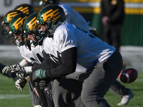 The Eskimos offensive line, shown here during practice last season, is largely made up of returning players. (Shaughn Butts)