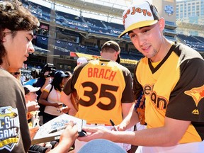Aaron Sanchez of the Toronto Blue Jays signs autographs during Gatorade All-Star Workout Day for the 87th Annual MLB All-Star game at PETCO Park in San Diego on July 11, 2016. (Harry How/Getty Images/AFP)