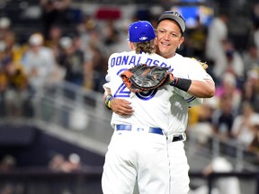 Josh Donaldson of the Toronto Blue Jays and Miguel Cabrera of the Detroit Tigers of the American League celebrate after defeating the National League during the 87th Annual MLB All-Star Game at PETCO Park in San Diego on July 12, 2016. (Harry How/Getty Images)