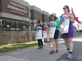 Childcare workers walk the picket line at the YMCA in Argyle Ave in Ottawa on Tuesday. Tony Caldwell photo.