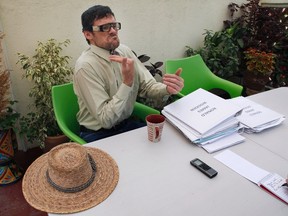 In this June 30, 2016 photo, American craftsman Ronald James Wooden pauses during an interview in Mexico City. Originally from Iowa, he says police detained and beat him three years ago for allegedly disturbing the peace, but Wooden says he was beaten because of a dispute with his neighbour, who claimed to belong to a local drug cartel who was demanding protection money. (AP Photo/Marco Ugarte)