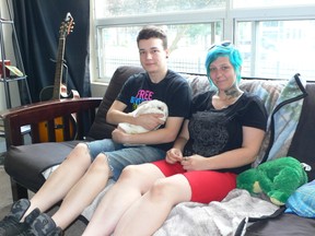 Shii’o Lyons and girlfriend Cat relax at his apartment with his pet rabbit.