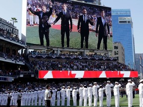 In this Tuesday, July 12, 2016 file photo, The Tenors, shown on the scoreboard, perform during the Canadian National Anthem prior to the MLB baseball All-Star Game, in San Diego. (AP photo)