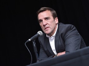 George McPhee speaks after being introduced as the general manager of the Las Vegas NHL franchise during a news conference at T-Mobile Arena in Las Vegas on July 13, 2016. (Ethan Miller/Getty Images)