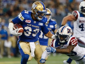 Andrew Harris in action against Montreal during the preseason in June. (The Canadian Press)