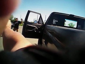 In this image made from a June 25, 2016, police body-camera video released by Fresno Police Department, a police officer points a gun at Dylan Noble, back left, in Fresno, Calif. Fresno police on Wednesday, July 13, released body-camera video of officers fatally shooting Noble, a 19-year-old man who ignored repeated commands to stand still and show his hands. (Fresno Police Department via AP)