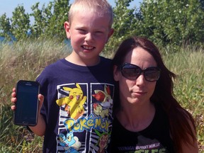 April Rathmell and her nine-year-old son, Jacob, have caught Pokemon Go fever. The Sarnia duo downloaded the augmented-reality mobile-phone game Monday and played for seven hours. (Terry Bridge/Sarnia Observer)