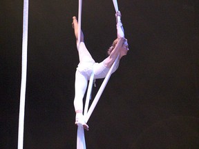 Jane Kirby performs aerial acrobatics during rehearsal for her co-written acrobatic folk opera, Beneath Our Feet, in the Grand Theatre on Wednesday July. The opera opens July 20 as part of the Kick and Push Festival. (Julia Balakrishnan/For The Whig-Standard)