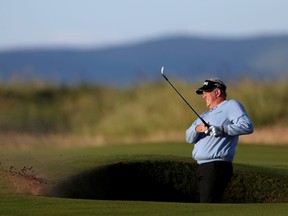Scotland’s Colin Montgomerie plays out of the bunker on the first hole during the first round of the British Open at the Royal Troon Golf Club in Troon, Scotland, Thursday, July 14, 2016. (David Davies/PA via AP)
