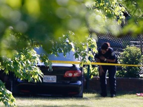 Two cars in a park off of Laura Road in North York after two cars were spotted shooting at each other. Two men are injured, one seriously  on Wednesday July 13, 2016. Michael Peake/Toronto Sun/Postmedia Network