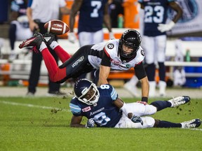 Ottawa Redblacks defender Antoine Pruneau breaks up a pass intended for Kenny Shaw of the Toronto Argonauts during CFL action at BMO Field in Toronto on Wednesday July 13, 2016. (Ernest Doroszuk/Toronto Sun/Postmedia Network)