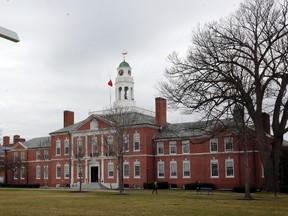 In this April 11, 2016 photo, part of the campus of the prestigious Phillips Exeter Academy is seen in Exeter, N.H. The principal of the elite prep school dealing with a series of sexual abuse allegations acknowledged Friday, April 22, 2016, it represented a “dark moment” but said the school will emerge from the crisis strong and healthy. Phillips Exeter Academy Principal Lisa MacFarlane spoke to The Associated Press following revelations last month about former teacher Rick Schubart. Schubart was forced to resign in 2011 after admitting sexual misconduct dating to the 1970s and was barred from campus after more misconduct surfaced in 2015. (AP Photo/Jim Cole, File)