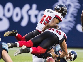 Ottawa Redblacks Damaso Munoz and Connor Williams sack Argos QB Ricky Ray on Wednesday. (Ernest Doroszuk/Toronto Sun)