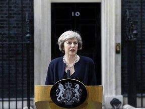 In this Wednesday July 13, 2016 file photo, new British Prime Minister Theresa May speaks to the media outside her official residence, 10 Downing Street in London. (AP Photo/Kirsty Wigglesworth, file)