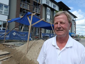 Mike Moore, president of the Manitoba Builders Association, said the industry has mixed thoughts on whether the condo market in Winnipeg is saturated. Pictured near a condominium project nearing completion in Bridgewater Forest on Thu., July 14, 2016.