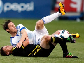 Former Montreal Impact midfielder Maxim Tissot (top) is expected to join Fury FC. (AP)