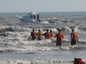 Rescue efforts at the main beach in Port Stanley for an 18-year-old male who didn't make it back to shore. He was swimming with a 19-year-old female when they appeared to be in distress at about 3:50 p.m., Elgin OPP said. The female returned to shore. (IAN McCALLUM, St. Thomas Times-Journal)