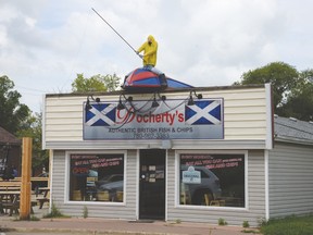 Docherty’s Fish ‘n’ Chips was told by the City it must remove the fisherman and boat sign from its roof because it contravenes the Land Use Bylaw, which only allows signage at pedestrian level in the City Centre. - Photo by Marcia Love
