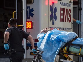 A man suffered non life threatening burns after he set himself on fire in front of the WCB building in Edmonton on July 15, 2016. Photo by Shaughn Butts / Postmedia