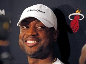 Miami Heat guard Dwyane Wade talks to reporters Tuesday, May 17, 2016, in Miami. The Toronto Raptors eliminated the Heat from the NBA playoffs with a 116-89 win Sunday. (Al Diaz/Miami Herald via AP)