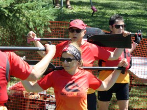 Warriors of Hope warm up for a race during the Sudbury Dragon Boat Festival in this file photo. Ben Leeson/The Sudbury Star/Postmedia Network