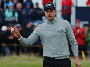 Henrik Stenson acknowledges the crowd after making a birdie on the 14th hole during the third round of the British Open at the Royal Troon Golf Club in Troon, Scotland, Saturday, July 16, 2016. (AP Photo/Ben Curtis)