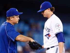 Toronto Blue Jays manager John Gibbons pulls relief pitcher Brett Cecil during American League action against the Chicago White Sox in Toronto on Monday, April 25, 2016. (THE CANADIAN PRESS/Frank Gunn)