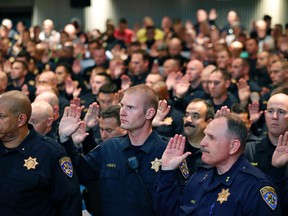 Over 300 officers from other jurisdictions are sworn in to have police powers in Cleveland, as preparations are made for the Republican National Convention, Saturday, July 16, 2016, in Cleveland, Ohio. (AP Photo/Alex Brandon)