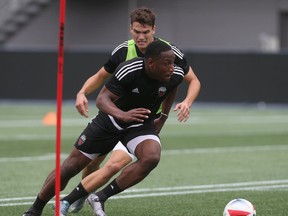 Fury FC’s Eddie Edward (front) runs for the ball during training at TD Place. (Tony Caldwell, Ottawa Sun)