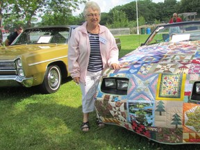 Marion Ford, of Brigden, stands with her 1983 Mustang convertable, and the quilted cover she recently made for it, during Hobbyfest in Centennial Park on Sunday July 17, 2016 in Sarnia, Ont. Paul Morden/Sarnia Observer/Postmedia Network
