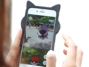 Gamers showed up at Confederation Park in Ottawa on July 12, 2016, to play "Pokemon Go." (Jean Levac/Postmedia Network)