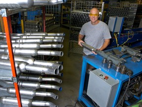 Patrick Bruder, president of Exhaust Direct is shown in the manufacturing area where they build for the automotive after market. (File photo)