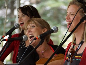 Suzy Wilde, left, Lisa Olafson and Alison Porter of Toronto?s Dirty Dishes shared light-hearted songs and banter as part of a Home Country centre stage workshop on Sunday at Victoria Park. (Cameron Paton, Special to Postmedia News)