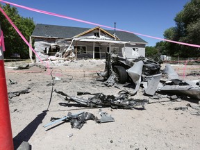 Damage from a Wednesday night bombing in Panaca, Nev.,  is viewed Friday, July 15, 2016. A man with two powerful bombs killed himself detonating a vehicle outside and an explosive inside a home after a woman and two girls fled for their lives, officials said Thursday. (Brett Le Blanc/Las Vegas Review-Journal via AP)