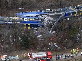 This Tuesday, Feb. 9, 2016 file photo shows an aerial view of rescue teams at the site where two trains collided head-on near Bad Aibling, Germany. (AP Photo/Matthias Schrader, file)