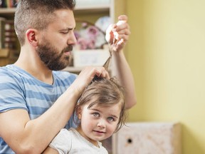 Daddies get schooled on how to style daughters' hair. (Getty)