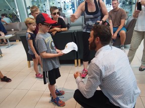 Brandon Prust signs autographs after making his announcement. (Supplied photo)