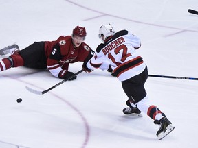 New Jersey Devils centre Reid Boucher shoots and scores a goal as Arizona Coyotes defenceman Connor Murphy defends during the first period of an NHL game on Jan. 16, 2016 in Glendale, Ariz. Both players are former Sarnia Sting players, and Murphy is confirmed to participate in the Sting's new alumni golf tournament on Aug. 2 at Sawmill Creek Golf Resort and Spa. (Matt Kartozian-USA TODAY Sports)