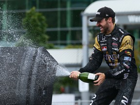 James Hinchcliffe celebrates his third-place finish during the Honda Indy in Toronto on July 17, 2016. (Dave Abel/Toronto Sun/Postmedia Network)