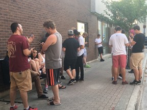 A group of Pokemon Go players gathers at the corner of Frank and Front streets on Monday, July 18. JONATHAN JUHA/STRATHROY AGE DISPATCH/POSTMEDIA NETWORK
