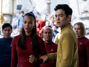 Zoe Saldana, left, as Uhura and John Cho as Sulu appear in a scene from, "Star Trek Beyond."
