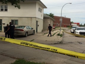 Police investigate on Inman Avenue, near St. Mary's Road, following a shots fired incident on Tuesday morning. (DAVID LARKINS/WINNIPEG SUN PHOTO)