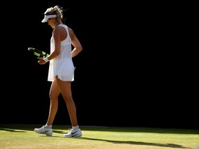 Eugenie Bouchard of Canada looks on during the Ladies Singles third round match against Dominika Cibulkova of Slovakia on day six of the Wimbledon Lawn Tennis Championships at the All England Lawn Tennis and Croquet Club on July 2, 2016 in London, England.  (Clive Brunskill/Getty Images)