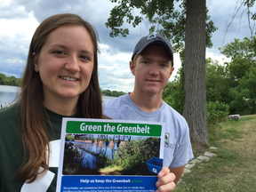 Ernst Kuglin/The Intelligencer
Miya Hemmersbach, special events outreach assistant with Quinte Waste Solutions, and Riley Allen, education outreach assistant with Lower Trent Conservation, started hand delivering pamphlets to residents and businesses along the Trenton Greenbelt Tuesday afternoon. The pamphlets explain how to keep the greenbelt green and free of wind-blown recyclable material that often litters the conservation area.