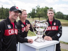 Members of the Canadian Olympic Golf team (from left to right) Graham DeLaet, Alena Sharp and David Hearn pose with the 1904 Olympic Golf Trophy, following a ceremony at Glen Abbey Golf Club in Oakville, Ont., on Tuesday, July 19, 2016. The team also includes Brooke Henderson who was unable to attend the announcement. (Chris Young/The Canadian Press)